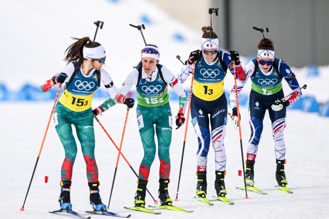 (260219) -- ANTERSELVA, Feb. 19, 2026 (Xinhua) -- Lou Jeanmonnot (1st R) and Oceane Michelon (2nd R) of France complete the handover during the biathlon women's 4x6km relay at the 2026 Milan-Cortina Winter Olympics in Anterselva, Italy, Feb. 18, 2026. (Xinhua/Jiang Han)