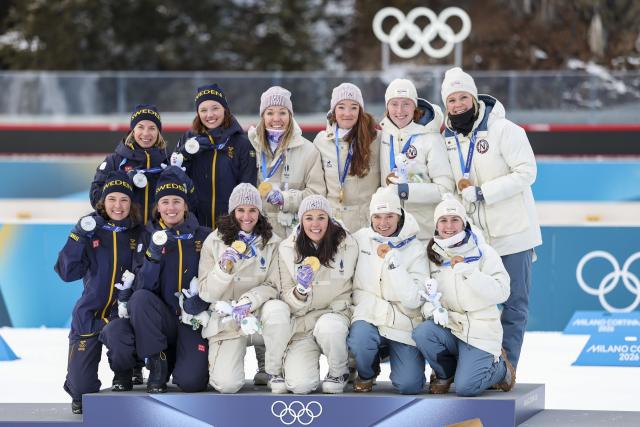 (260219) -- ANTERSELVA, Feb. 19, 2026 (Xinhua) -- Gold medalists Team France (C), silver medalists Team Sweden (L) and bronze medalists Team Norway pose for photos during the awarding ceremony for the biathlon women's 4x6km relay at the 2026 Milan-Cortina Winter Olympics in Anterselva, Italy, Feb. 18, 2026. (Xinhua/Zhang Tao)