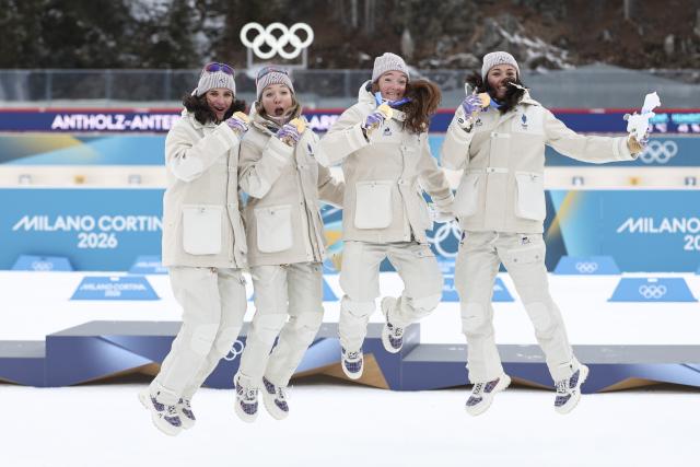 (260219) -- ANTERSELVA, Feb. 19, 2026 (Xinhua) -- Gold medalists Julia Simon, Oceane Michelon, Lou Jeanmonnot and Camille Bened (from L to R) of France pose for photos after the awarding ceremony for the biathlon women's 4x6km relay at the 2026 Milan-Cortina Winter Olympics in Anterselva, Italy, Feb. 18, 2026. (Xinhua/Zhang Tao)
