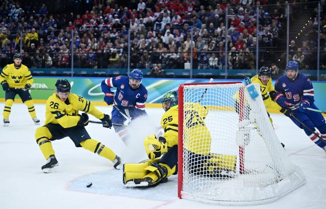 (260219) -- MILAN, Feb. 19, 2026 (Xinhua) -- Jacob Markstrom (3rd R) of Sweden saves a goal during the ice hockey men's play-offs quarterfinal between Sweden and the United States at the Milan-Cortina 2026 Olympic Winter Games in Milan, Italy, Feb. 18, 2026. (Xinhua/Zhang Haofu)
