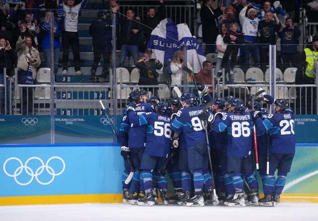 (260219) -- MILAN, Feb. 19, 2026 (Xinhua) -- Finland's players celebrate victory after the ice hockey men's play-offs quarterfinal between Finland and Switzerland at the Milan-Cortina 2026 Olympic Winter Games in Milan, Italy, Feb. 18, 2026. (Xinhua/Tao Xiyi)