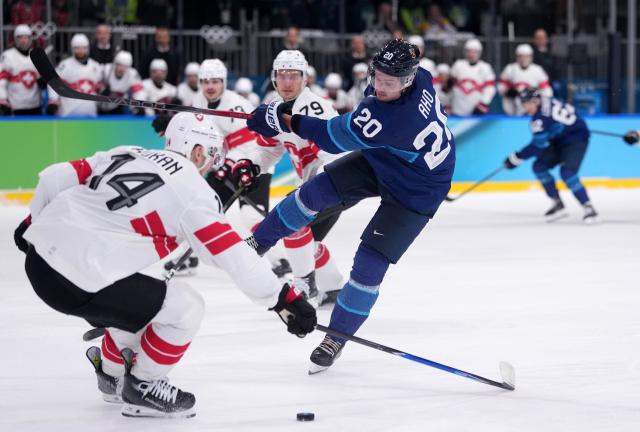 (260219) -- MILAN, Feb. 19, 2026 (Xinhua) -- Sebastian Aho (front R) of Finland fights for the puck against Dean Kukan of Switzerland during the ice hockey men's play-offs quarterfinal between Finland and Switzerland at the Milan-Cortina 2026 Olympic Winter Games in Milan, Italy, Feb. 18, 2026. (Xinhua/Tao Xiyi)