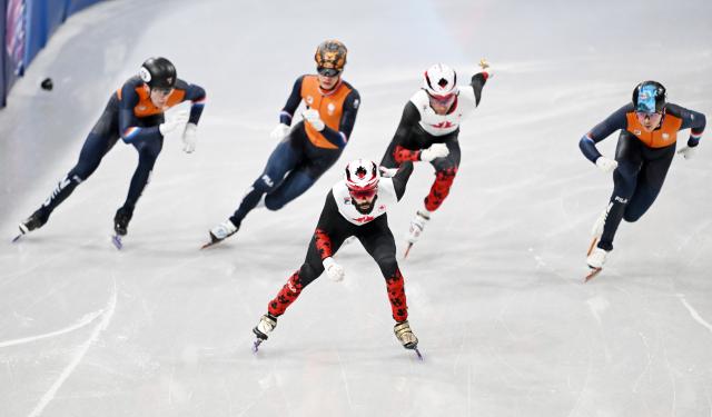 (260219) -- MILAN, Feb. 19, 2026 (Xinhua) -- Steven Dubois (front) of Canada competes during the short track speed skating men's 500m final A at the Milan-Cortina 2026 Olympic Winter Games in Milan, Italy, Feb. 18, 2026. (Xinhua/Cheng Min)
