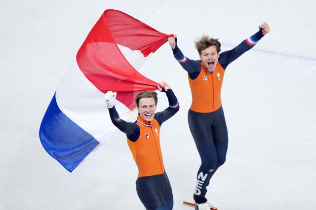 (260219) -- MILAN, Feb. 19, 2026 (Xinhua) -- Melle van't Wout (R) and Jens van't Wout of the Netherlands celebrate after the short track speed skating men's 500m final A at the Milan-Cortina 2026 Olympic Winter Games in Milan, Italy, Feb. 18, 2026. (Xinhua/Xue Yuge)