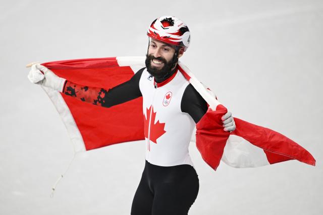 (260219) -- MILAN, Feb. 19, 2026 (Xinhua) -- Steven Dubois of Canada celebrates after winning the short track speed skating men's 500m final A at the Milan-Cortina 2026 Olympic Winter Games in Milan, Italy, Feb. 18, 2026. (Xinhua/Cheng Min)
