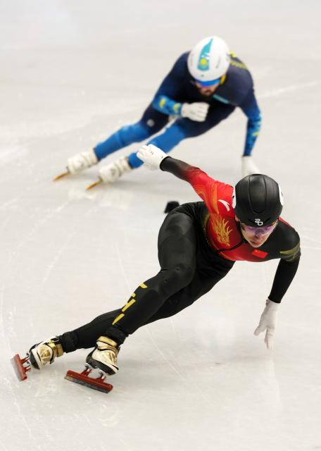 (260219) -- MILAN, Feb. 19, 2026 (Xinhua) -- Liu Shaoang (front) of China competes during the short track speed skating men's 500m final B at the Milan-Cortina 2026 Olympic Winter Games in Milan, Italy, Feb. 18, 2026. (Xinhua/Lai Xiangdong)