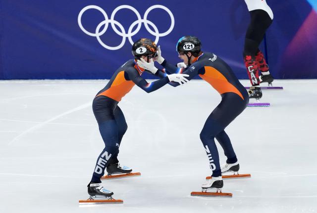 (260219) -- MILAN, Feb. 19, 2026 (Xinhua) -- Melle van't Wout (R) and Jens van't Wout of the Netherlands celebrate after the short track speed skating men's 500m final A at the Milan-Cortina 2026 Olympic Winter Games in Milan, Italy, Feb. 18, 2026. (Xinhua/Xue Yuge)