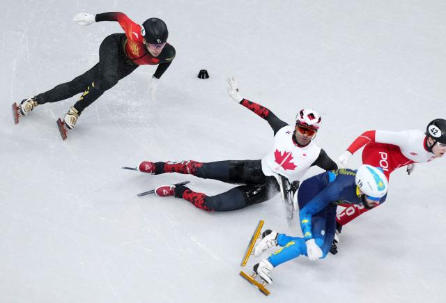 (260219) -- MILAN, Feb. 19, 2026 (Xinhua) -- Maxime Laoun (2nd L) of Canada falls during the short track speed skating men's 500m final B at the Milan-Cortina 2026 Olympic Winter Games in Milan, Italy, Feb. 18, 2026. (Xinhua/Xue Yuge)