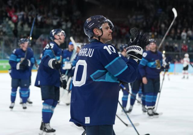 (260219) -- MILAN, Feb. 19, 2026 (Xinhua) -- Henri Jokiharju of Finland celebrates victory after the ice hockey men's play-offs quarterfinal between Finland and Switzerland at the Milan-Cortina 2026 Olympic Winter Games in Milan, Italy, Feb. 18, 2026. (Xinhua/Sun Fei)