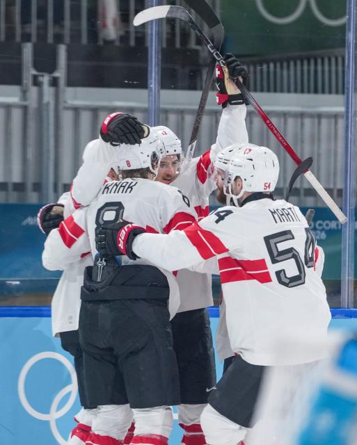 (260219) -- MILAN, Feb. 19, 2026 (Xinhua) -- Players of Switzerland celebrate a goal during the ice hockey men's play-offs quarterfinal between Finland and Switzerland at the Milan-Cortina 2026 Olympic Winter Games in Milan, Italy, Feb. 18, 2026. (Xinhua/Sun Fei)