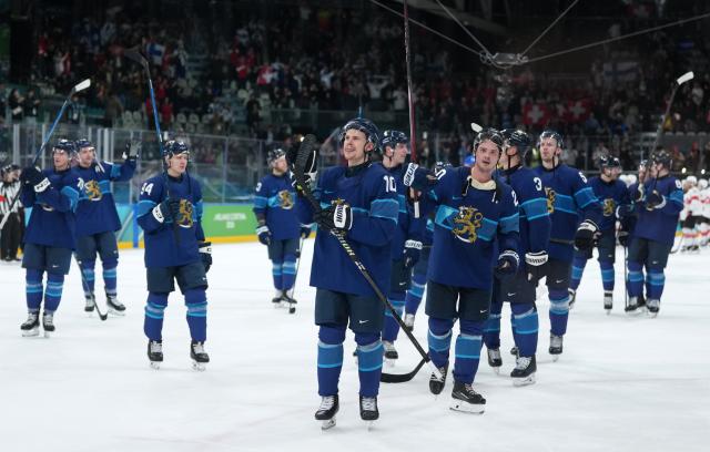 (260219) -- MILAN, Feb. 19, 2026 (Xinhua) -- Players of Finland celebrate victory after the ice hockey men's play-offs quarterfinal between Finland and Switzerland at the Milan-Cortina 2026 Olympic Winter Games in Milan, Italy, Feb. 18, 2026. (Xinhua/Sun Fei)