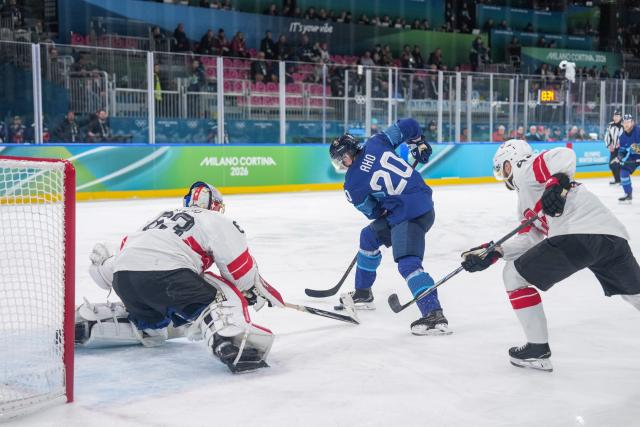(260219) -- MILAN, Feb. 19, 2026 (Xinhua) -- Sebastian Aho (C) of Finland shoots during the ice hockey men's play-offs quarterfinal between Finland and Switzerland at the Milan-Cortina 2026 Olympic Winter Games in Milan, Italy, Feb. 18, 2026. (Xinhua/Sun Fei)