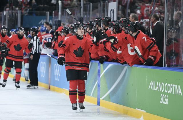(260219) -- MILAN, Feb. 19, 2026 (Xinhua) -- Macklin Celebrini (L) of Canada celebrates with teammates during the ice hockey men's play-offs quarterfinals match between Canada and the Czech Republic at the Milan-Cortina 2026 Olympic Winter Games in Milan, Italy, Feb. 18, 2026. (Xinhua/Zhang Haofu)