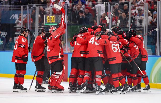 (260219) -- MILAN, Feb. 19, 2026 (Xinhua) -- Players of Canada celebrate after winning the ice hockey men's play-offs quarterfinals match between Canada and the Czech Republic at the Milan-Cortina 2026 Olympic Winter Games in Milan, Italy, Feb. 18, 2026. (Xinhua/Wang Kaiyan)
