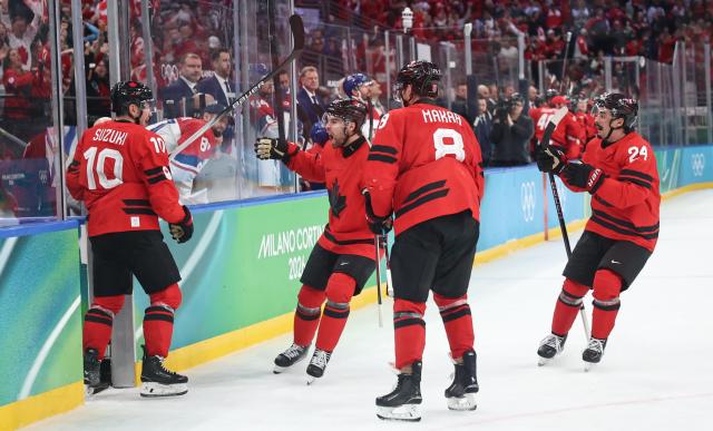 (260219) -- MILAN, Feb. 19, 2026 (Xinhua) -- Players of Canada celebrate a goal during the ice hockey men's play-offs quarterfinals match between Canada and the Czech Republic at the Milan-Cortina 2026 Olympic Winter Games in Milan, Italy, Feb. 18, 2026. (Xinhua/Wang Kaiyan)