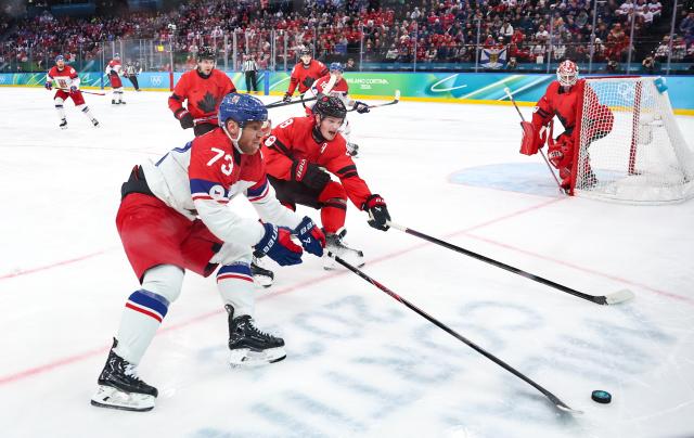 (260219) -- MILAN, Feb. 19, 2026 (Xinhua) -- Ondrej Kase (front) of the Czech Republic competes during the ice hockey men's play-offs quarterfinals match between Canada and the Czech Republic at the Milan-Cortina 2026 Olympic Winter Games in Milan, Italy, Feb. 18, 2026. (Xinhua/Wang Kaiyan)