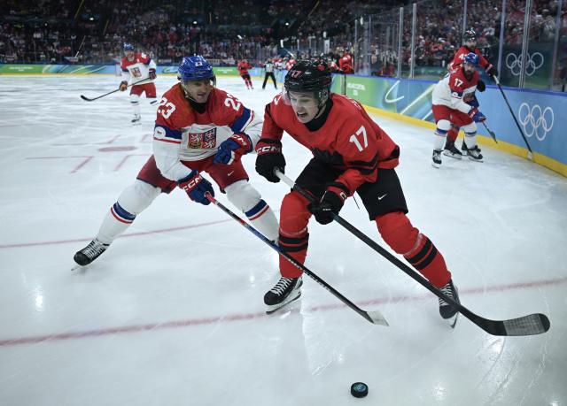 (260219) -- MILAN, Feb. 19, 2026 (Xinhua) -- Lukas Sedlak (L) of the Czech Republic vies with Macklin Celebrini of Canada during the ice hockey men's play-offs quarterfinals match between Canada and the Czech Republic at the Milan-Cortina 2026 Olympic Winter Games in Milan, Italy, Feb. 18, 2026. (Xinhua/Zhang Haofu)