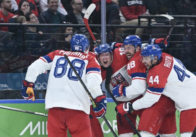 (260219) -- MILAN, Feb. 19, 2026 (Xinhua) -- Players of the Czech Republic celebrate a goal during the ice hockey men's play-offs quarterfinals match between Canada and the Czech Republic at the Milan-Cortina 2026 Olympic Winter Games in Milan, Italy, Feb. 18, 2026. (Xinhua/Zhang Haofu)