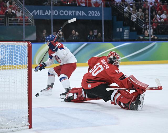 (260219) -- MILAN, Feb. 19, 2026 (Xinhua) -- Ondrej Palat (L) of the Czech Republic scores during the ice hockey men's play-offs quarterfinals match between Canada and the Czech Republic at the Milan-Cortina 2026 Olympic Winter Games in Milan, Italy, Feb. 18, 2026. (Xinhua/Zhang Haofu)