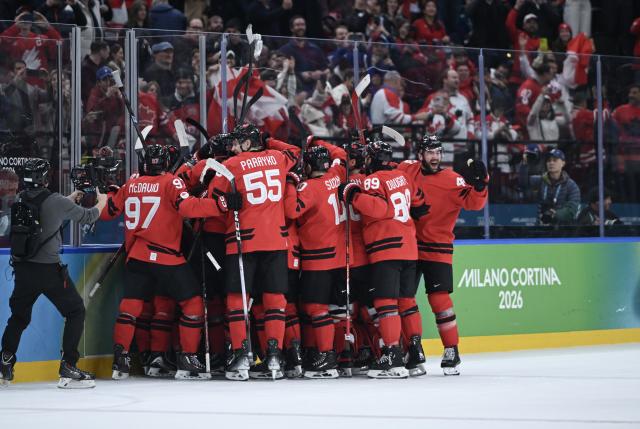 (260219) -- MILAN, Feb. 19, 2026 (Xinhua) -- Players of Canada celebrate after winning the ice hockey men's play-offs quarterfinals match between Canada and the Czech Republic at the Milan-Cortina 2026 Olympic Winter Games in Milan, Italy, Feb. 18, 2026. (Xinhua/Zhang Haofu)