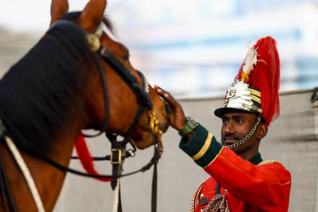 (260219) -- KATHMANDU, Feb. 19, 2026 (Xinhua) -- A Nepalese Army cavalry soldier prepares a horse ahead of the 76th National Democracy Day celebrations in Kathmandu, Nepal, Feb. 19, 2026. (Photo by Sulav Shrestha/Xinhua)