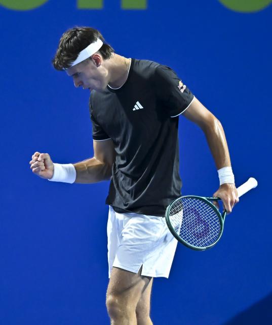 (260219) -- DOHA, Feb. 19, 2026 (Xinhua) -- Jakub Mensik of the Czech Republic reacts during the men's singles round of 16 match between Zhang Zhizhen of China and Jakub Mensik of the Czech Republic at the ATP Qatar Open 2026 tennis tournament in Doha, Qatar, on Feb. 18, 2026. (Photo by Nikku/Xinhua)
