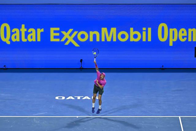 (260219) -- DOHA, Feb. 19, 2026 (Xinhua) -- Valentin Royer of France serves during the men's singles round of 16 match between Carlos Alcaraz of Spain and Valentin Royer of France at the ATP Qatar Open 2026 tennis tournament in Doha, Qatar, on Feb. 18, 2026. (Photo by Nikku/Xinhua)