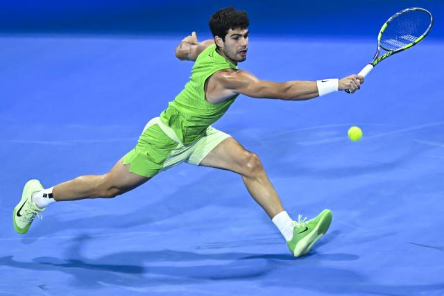 (260219) -- DOHA, Feb. 19, 2026 (Xinhua) -- Carlos Alcaraz of Spain hits a return during the men's singles round of 16 match between Carlos Alcaraz of Spain and Valentin Royer of France at the ATP Qatar Open 2026 tennis tournament in Doha, Qatar, on Feb. 18, 2026. (Photo by Nikku/Xinhua)