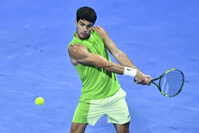 (260219) -- DOHA, Feb. 19, 2026 (Xinhua) -- Carlos Alcaraz of Spain hits a return during the men's singles round of 16 match between Carlos Alcaraz of Spain and Valentin Royer of France at the ATP Qatar Open 2026 tennis tournament in Doha, Qatar, on Feb. 18, 2026. (Photo by Nikku/Xinhua)