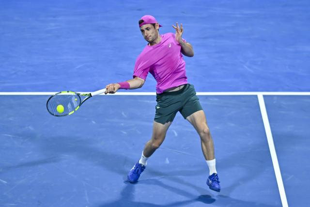 (260219) -- DOHA, Feb. 19, 2026 (Xinhua) -- Valentin Royer of France hits a return during the men's singles round of 16 match between Carlos Alcaraz of Spain and Valentin Royer of France at the ATP Qatar Open 2026 tennis tournament in Doha, Qatar, on Feb. 18, 2026. (Photo by Nikku/Xinhua)