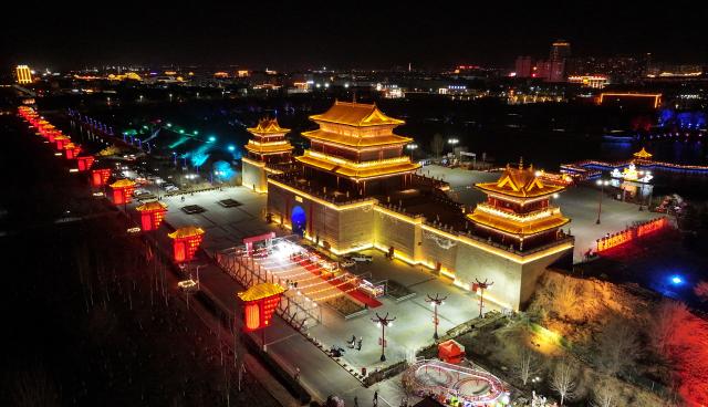 (260219) -- BEIJING, Feb. 19, 2026 (Xinhua) -- An aerial drone photo taken on Feb. 18, 2026 shows a night view in Yanchi County, northwest China's Ningxia Hui Autonomous Region. During the Spring Festival, lantern decorations across the country created a joyful atmosphere for the holiday. (Xinhua/Feng Kaihua)