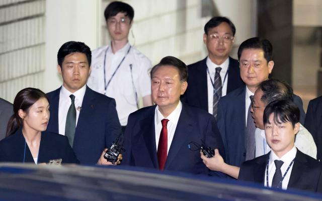 (260219) -- SEOUL, Feb. 19, 2026 (Xinhua) -- This file photo shows South Korea's former President Yoon Suk-yeol after a hearing in Seoul, South Korea, July 9, 2025.
  South Korea's former President Yoon Suk-yeol was sentenced to life in prison on charges of insurrection stemming from his declaration of emergency martial law, live footage showed Thursday.
   The Seoul Central District Court delivered its ruling, which was broadcast live to the public, saying the crux of Yoon's martial law case was the fact that troops were deployed to the National Assembly. (NEWSIS/Handout via Xinhua)