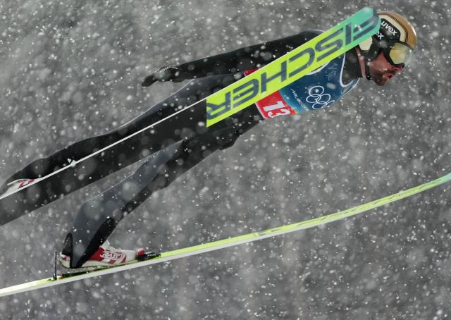 (260219) -- PREDAZZO, Feb. 19, 2026 (Xinhua) -- Johannes Rydzek of Germany competes during the ski jumping competition round of the nordic combined team sprint at the 2026 Milan-Cortina Winter Olympics in Predazzo, Italy, Feb. 19, 2026. (Xinhua/Meng Yongmin)