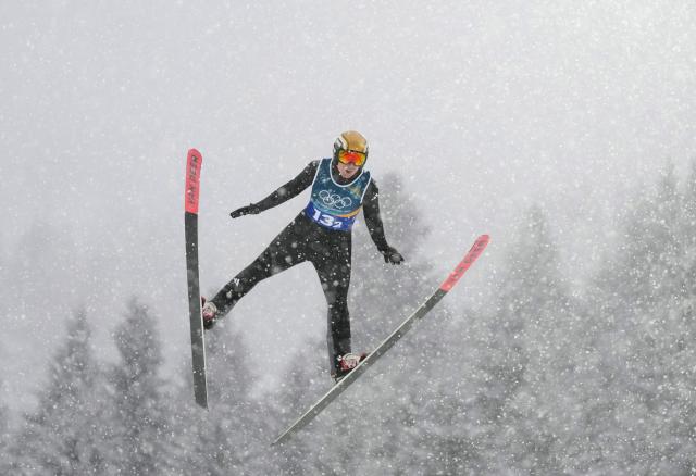 (260219) -- PREDAZZO, Feb. 19, 2026 (Xinhua) -- Vinzenz Geiger of Germany competes during the ski jumping competition round of the nordic combined team sprint at the 2026 Milan-Cortina Winter Olympics in Predazzo, Italy, Feb. 19, 2026. (Xinhua/Meng Yongmin)