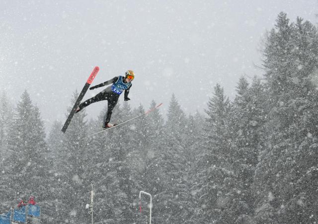 (260219) -- PREDAZZO, Feb. 19, 2026 (Xinhua) -- Vinzenz Geiger of Germany competes during the ski jumping trial round of the nordic combined team sprint at the 2026 Milan-Cortina Winter Olympics in Predazzo, Italy, Feb. 19, 2026. (Xinhua/Meng Yongmin)