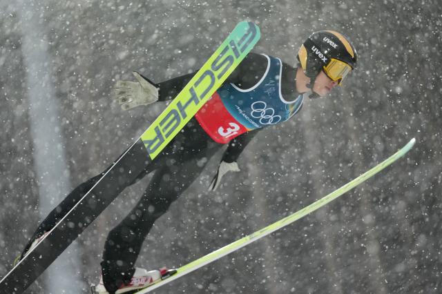 (260219) -- PREDAZZO, Feb. 19, 2026 (Xinhua) -- Zhao Zihe of China competes during the ski jumping competition round of the nordic combined team sprint at the 2026 Milan-Cortina Winter Olympics in Predazzo, Italy, Feb. 19, 2026. (Xinhua/Meng Yongmin)