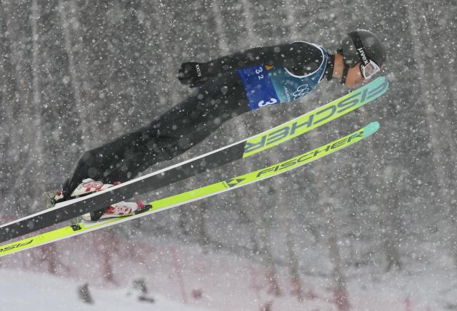 (260219) -- PREDAZZO, Feb. 19, 2026 (Xinhua) -- Zhao Jiawen of China competes during the ski jumping competition round of the nordic combined team sprint at the 2026 Milan-Cortina Winter Olympics in Predazzo, Italy, Feb. 19, 2026. (Xinhua/Meng Yongmin)