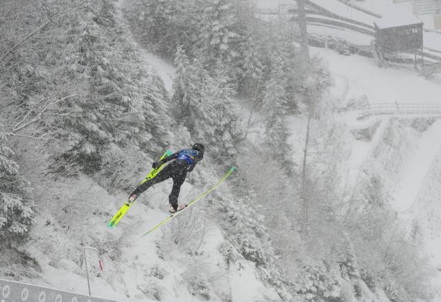 (260219) -- PREDAZZO, Feb. 19, 2026 (Xinhua) -- Zhao Jiawen of China competes during the ski jumping competition round of the nordic combined team sprint at the 2026 Milan-Cortina Winter Olympics in Predazzo, Italy, Feb. 19, 2026. (Xinhua/Meng Yongmin)