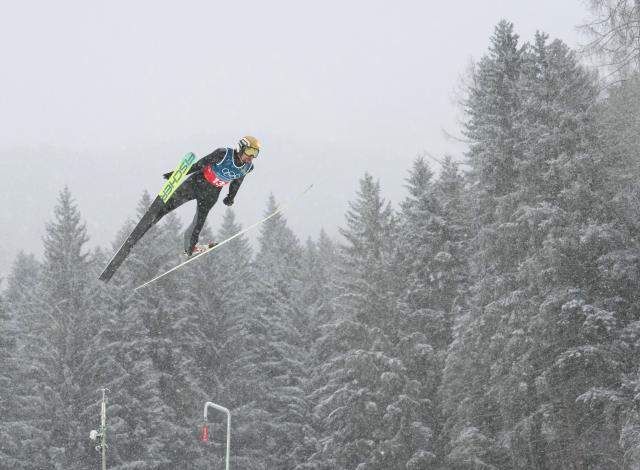 (260219) -- PREDAZZO, Feb. 19, 2026 (Xinhua) -- Johannes Rydzek of Germany competes during the ski jumping trial round of the nordic combined team sprint at the 2026 Milan-Cortina Winter Olympics in Predazzo, Italy, Feb. 19, 2026. (Xinhua/Meng Yongmin)
