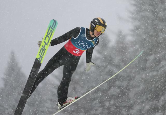 (260219) -- PREDAZZO, Feb. 19, 2026 (Xinhua) -- Zhao Zihe of China competes during the ski jumping competition round of the nordic combined team sprint at the 2026 Milan-Cortina Winter Olympics in Predazzo, Italy, Feb. 19, 2026. (Xinhua/Meng Yongmin)