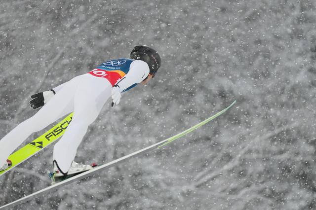 (260219) -- PREDAZZO, Feb. 19, 2026 (Xinhua) -- Watabe Akito of Japan competes during the ski jumping competition round of the nordic combined team sprint at the 2026 Milan-Cortina Winter Olympics in Predazzo, Italy, Feb. 19, 2026. (Xinhua/Meng Yongmin)