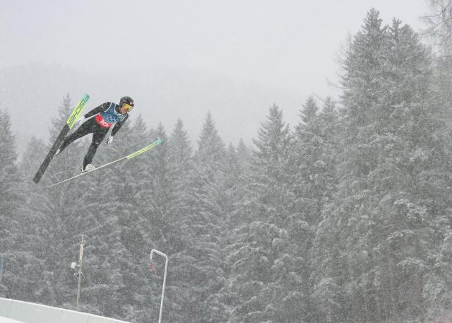 (260219) -- PREDAZZO, Feb. 19, 2026 (Xinhua) -- Watabe Akito of Japan competes during the ski jumping trial round of the nordic combined team sprint at the 2026 Milan-Cortina Winter Olympics in Predazzo, Italy, Feb. 19, 2026. (Xinhua/Meng Yongmin)