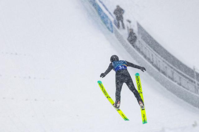 (260219) -- PREDAZZO, Feb. 19, 2026 (Xinhua) -- Zhao Jiawen of China competes during the ski jumping competition round of the nordic combined team sprint at the 2026 Milan-Cortina Winter Olympics in Predazzo, Italy, Feb. 19, 2026. (Xinhua/Huang Wei)