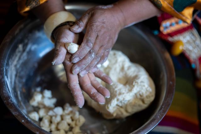 (260219) -- LHASA, Feb. 19, 2026 (Xinhua) -- Drolma Tsering makes "gutu," a kind of soup made of flour, at home in Gurum Village of Chamco Township, Dingri County, southwest China's Xizang Autonomous Region, Feb. 16, 2026.  "Gu" in Tibetan means nine and "Tu" means pasta. At the Night of Gutu, the whole family and relatives gather to enjoy the dish and celebrate the occasion.
  Monday was the Chinese New Year's Eve, which coincided with the Night of Gutu of the Tibetan calendar. Enjoying the festive atmosphere, the family of Sangs-rgyas purchased new furniture and stocked up on New Year goods, celebrating their first Spring Festival and Tibetan New Year after moving into their new house.
  Last year, a 6.8 magnitude earthquake hit Dingri, home to the northern base camp of the world's highest peak, Mount Qomolangma, and other counties in the region on Jan. 7. In less than three days after the earthquake, Xizang rolled out a post-disaster reconstruction plan and kicked off the reconstruction work later. In the second half of 2025, the family of Sangs-rgyas moved into a safe and comfortable new residence. (Xinhua/Tenzing Nima Qadhup)