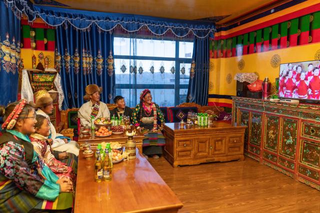 (260219) -- LHASA, Feb. 19, 2026 (Xinhua) -- The family of Sangs-rgyas watches the China Central Television's "Spring Festival Gala" at home in Gurum Village of Chamco Township, Dingri County, southwest China's Xizang Autonomous Region, Feb. 16, 2026.
  Monday was the Chinese New Year's Eve, which coincided with the Night of Gutu of the Tibetan calendar. Enjoying the festive atmosphere, the family of Sangs-rgyas purchased new furniture and stocked up on New Year goods, celebrating their first Spring Festival and Tibetan New Year after moving into their new house.
  Last year, a 6.8 magnitude earthquake hit Dingri, home to the northern base camp of the world's highest peak, Mount Qomolangma, and other counties in the region on Jan. 7. In less than three days after the earthquake, Xizang rolled out a post-disaster reconstruction plan and kicked off the reconstruction work later. In the second half of 2025, the family of Sangs-rgyas moved into a safe and comfortable new residence. (Xinhua/Tenzing Nima Qadhup)