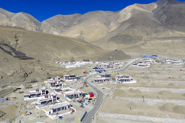 (260219) -- LHASA, Feb. 19, 2026 (Xinhua) -- An aerial drone photo taken on Feb. 16, 2026 shows a view of the houses reconstructed after earthquake in Gurum Village of Chamco Township, Dingri County, southwest China's Xizang Autonomous Region.
  Monday was the Chinese New Year's Eve, which coincided with the Night of Gutu of the Tibetan calendar. Enjoying the festive atmosphere, the family of Sangs-rgyas purchased new furniture and stocked up on New Year goods, celebrating their first Spring Festival and Tibetan New Year after moving into their new house.
  Last year, a 6.8 magnitude earthquake hit Dingri, home to the northern base camp of the world's highest peak, Mount Qomolangma, and other counties in the region on Jan. 7. In less than three days after the earthquake, Xizang rolled out a post-disaster reconstruction plan and kicked off the reconstruction work later. In the second half of 2025, the family of Sangs-rgyas moved into a safe and comfortable new residence. (Xinhua/Tenzing Nima Qadhup)