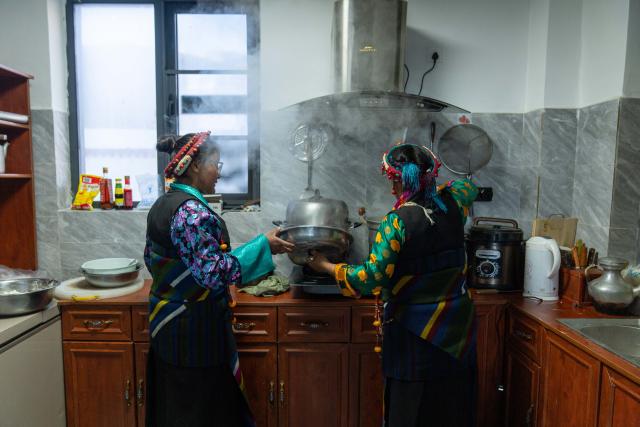 (260219) -- LHASA, Feb. 19, 2026 (Xinhua) -- Drolma Tsering (R) and her daughter Tenzin Wangmo make "gutu," a kind of soup made of flour, at home in Gurum Village of Chamco Township, Dingri County, southwest China's Xizang Autonomous Region, Feb. 16, 2026.  "Gu" in Tibetan means nine and "Tu" means pasta. At the Night of Gutu, the whole family and relatives gather to enjoy the dish and celebrate the occasion.
  Monday was the Chinese New Year's Eve, which coincided with the Night of Gutu of the Tibetan calendar. Enjoying the festive atmosphere, the family of Sangs-rgyas purchased new furniture and stocked up on New Year goods, celebrating their first Spring Festival and Tibetan New Year after moving into their new house.
  Last year, a 6.8 magnitude earthquake hit Dingri, home to the northern base camp of the world's highest peak, Mount Qomolangma, and other counties in the region on Jan. 7. In less than three days after the earthquake, Xizang rolled out a post-disaster reconstruction plan and kicked off the reconstruction work later. In the second half of 2025, the family of Sangs-rgyas moved into a safe and comfortable new residence. (Xinhua/Tenzing Nima Qadhup)