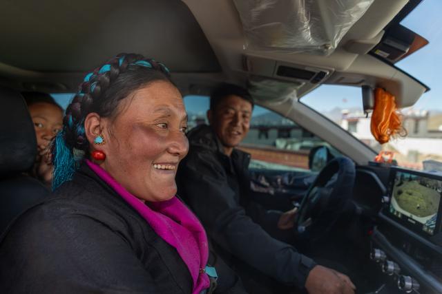 (260219) -- LHASA, Feb. 19, 2026 (Xinhua) -- Sangs-rgyas (R) drives to buy New Year goods with his wife Drolma Tsering (C) and his daughter Tenzin Kelyang in Gurum Village of Chamco Township, Dingri County, southwest China's Xizang Autonomous Region, Feb. 16, 2026.
  Monday was the Chinese New Year's Eve, which coincided with the Night of Gutu of the Tibetan calendar. Enjoying the festive atmosphere, the family of Sangs-rgyas purchased new furniture and stocked up on New Year goods, celebrating their first Spring Festival and Tibetan New Year after moving into their new house.
  Last year, a 6.8 magnitude earthquake hit Dingri, home to the northern base camp of the world's highest peak, Mount Qomolangma, and other counties in the region on Jan. 7. In less than three days after the earthquake, Xizang rolled out a post-disaster reconstruction plan and kicked off the reconstruction work later. In the second half of 2025, the family of Sangs-rgyas moved into a safe and comfortable new residence. (Xinhua/Tenzing Nima Qadhup)