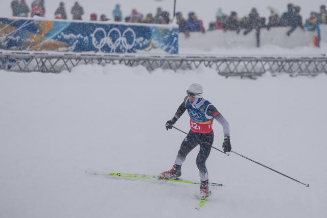 (260219) -- TESERO, Feb. 19, 2026 (Xinhua) -- Zhao Zihe of China competes during the cross-country event of the nordic combined team sprint at the 2026 Milan-Cortina Winter Olympics in Tesero, Italy, Feb. 19, 2026. (Xinhua/Peng Ziyang)