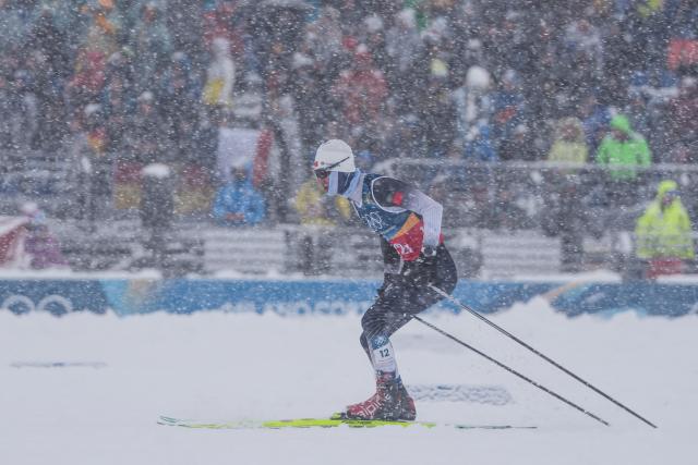 (260219) -- TESERO, Feb. 19, 2026 (Xinhua) -- Zhao Zihe of China competes during the cross-country event of the nordic combined team sprint at the 2026 Milan-Cortina Winter Olympics in Tesero, Italy, Feb. 19, 2026. (Xinhua/Peng Ziyang)